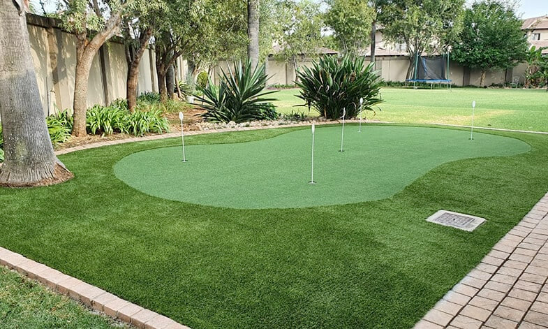 practice putting green installed in residential back garden